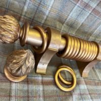 Gilt over Red pole with finials, brackets and rings.