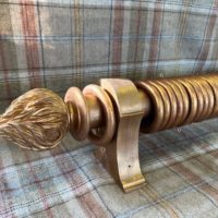 Distressed Gilt over Red pole wth rings, finials and brackets.