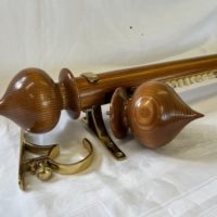 Pine tracked pole with brass brackets and pine finials