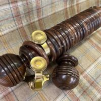Pitch pine pole, oak finials and rings, brass brackets