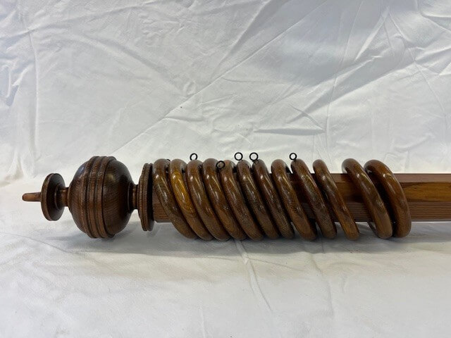 Octagonal pitch pine pole with finials and rings