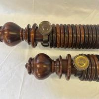Two Mahogany sets with Uncarved Verona finials, rings and brass brackets